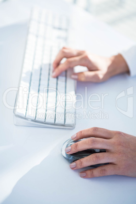Close up of a woman using a mouse