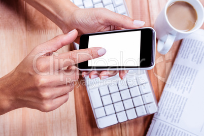 Businesswoman holding her smartphone