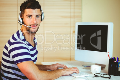 Handsome hipster working at desk