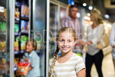 Smiling child with her family