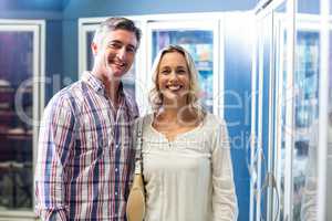 Smiling couple in supermarket