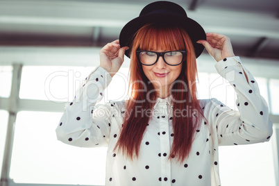 Attractive smiling hipster woman with hat