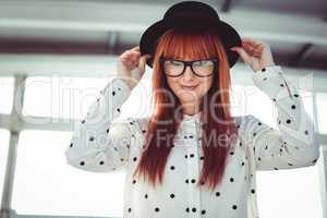 Attractive smiling hipster woman with hat