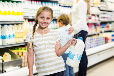Cute child holding milk