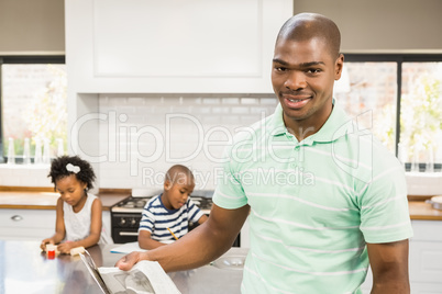 Smiling father reading newspaper