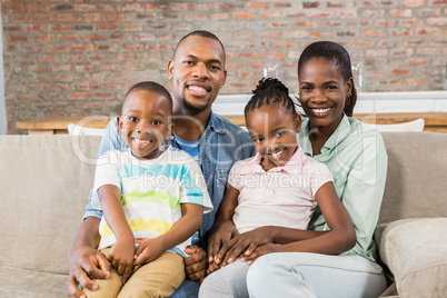 Happy family relaxing on the couch