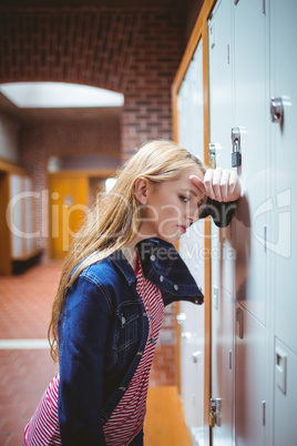 Worried leaning against the locker
