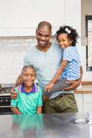 Father and kids in the kitchen