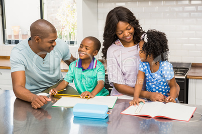 Parents helping children doing homework