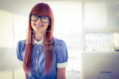 Attractive smiling hipster woman posing