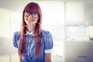 Attractive smiling hipster woman posing