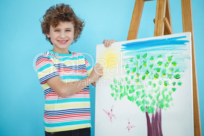 Smiling boy with his picture