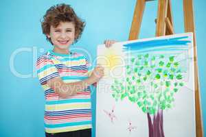 Smiling boy with his picture