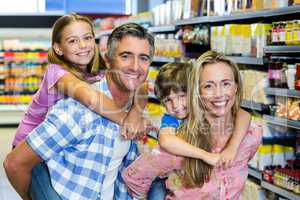 Happy family at the supermarket