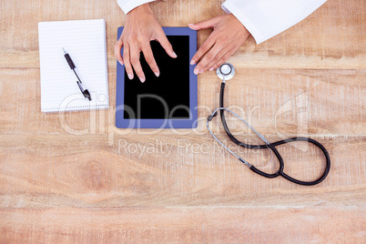 Doctor using digital tablet