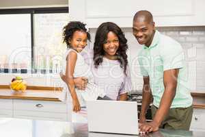 Happy family using laptop