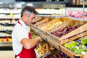 Seller filling vegetables box