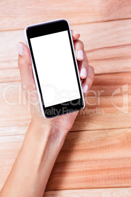 Feminine hand holding smartphone