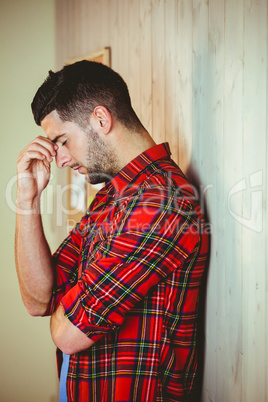 Handsome hipster feeling stressed out