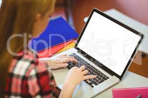 Blonde student using laptop during class