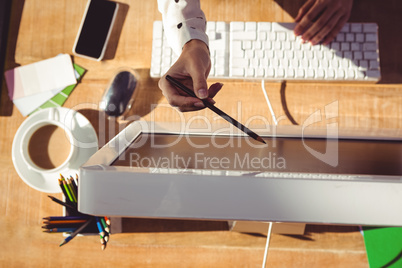 Cropped image of woman pointing the screen