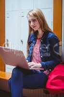 Smiling student sitting at the computer