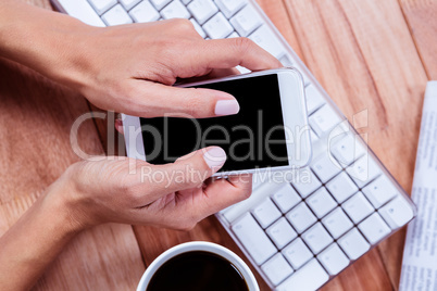 Businesswoman holding and smartphone