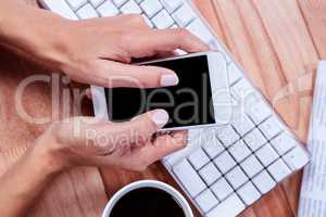 Businesswoman holding and smartphone