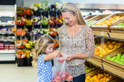 Mother and daughter picking out apple