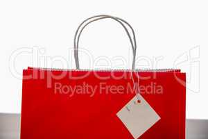 Red shopping gift bag with tag