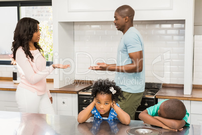 Parents arguing in front of children
