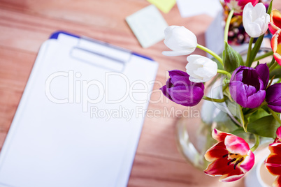 Bouquet of flower in a vase on the desk