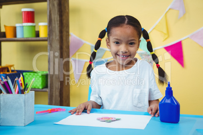 Smiling girl with her arts and crafts