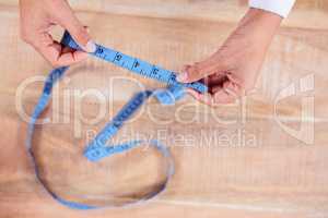 Woman holding measuring tape