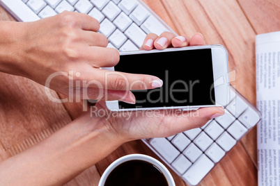 Businesswoman holding smartphone