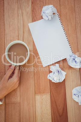 Cropped image of woman holding coffee cup