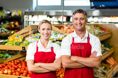 Portrait of smiling couple wearing apron