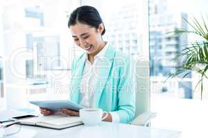 Businesswoman using her tablet pc