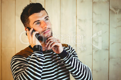 Casual hipster using his phone