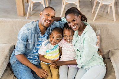 Happy family relaxing on the couch