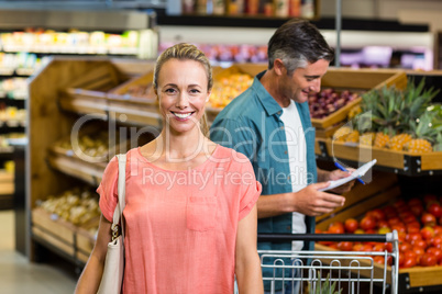 Smiling woman at the supermarket