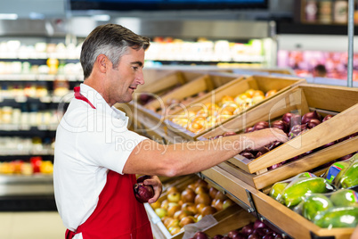 Seller filling vegetables box