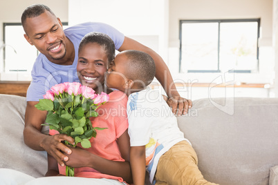 Son surprising mother with flowers