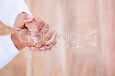 Close up view of hands on wood desk