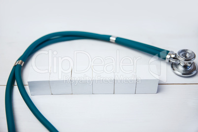 Blocks with stethoscope on desk
