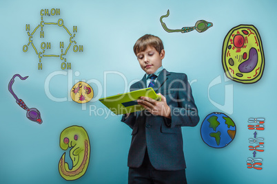 Boy in a business suit student working on the tablet keen icons