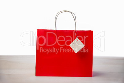 Red shopping gift bag with tag