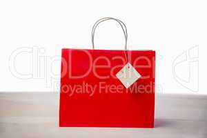 Red shopping gift bag with tag