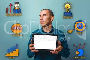 Male from businessman holding a tablet and is looking towards th