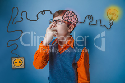 Teenage boy wearing glasses and an orange shirt, straightens his